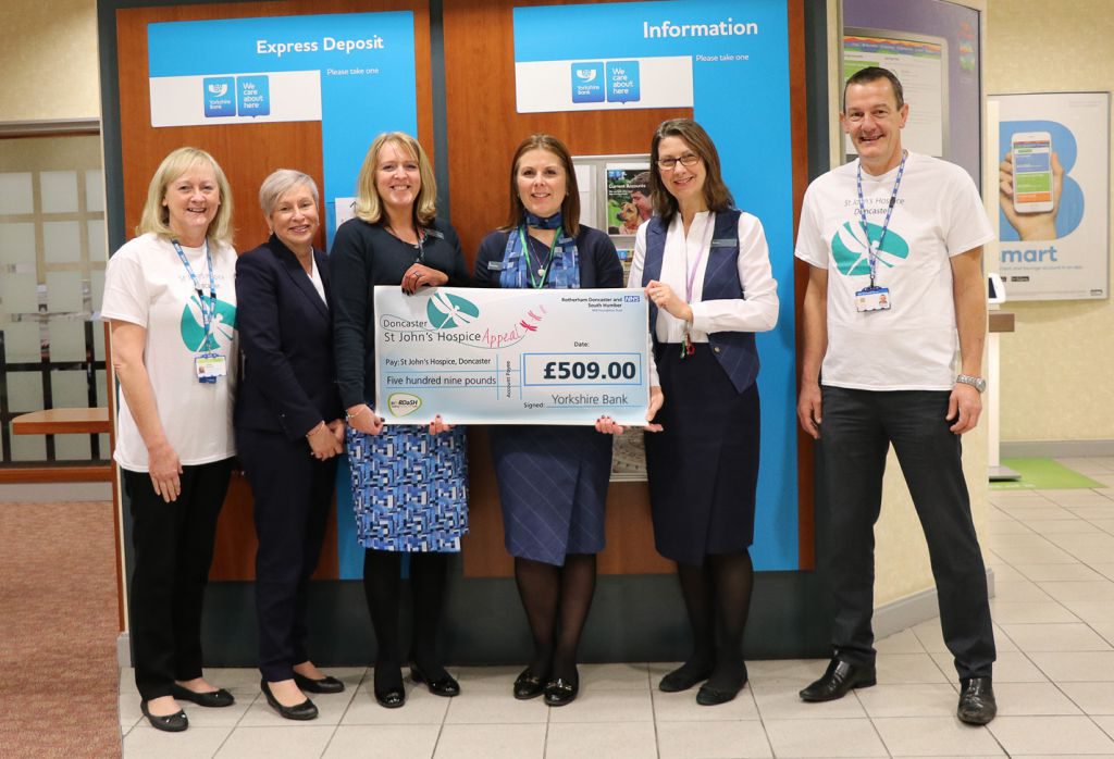 Lindsey Richards of the hospice appeal is pictured (far left), with Chris Smith of the hospice appeal (far right), together with staff from the Doncaster branch of Yorkshire Bank.