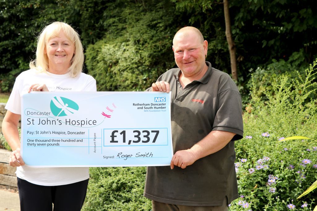 Roger is pictured (right) handing over £1,337 to Lindsey Richards of St John’s Hospice.