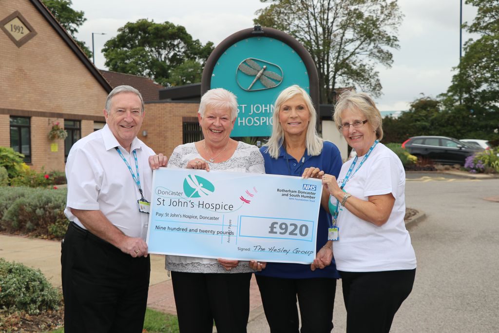 Deborah Lanceley and Jayne Gill (second and third from left) are pictured handing over the cheque with hospice staff.