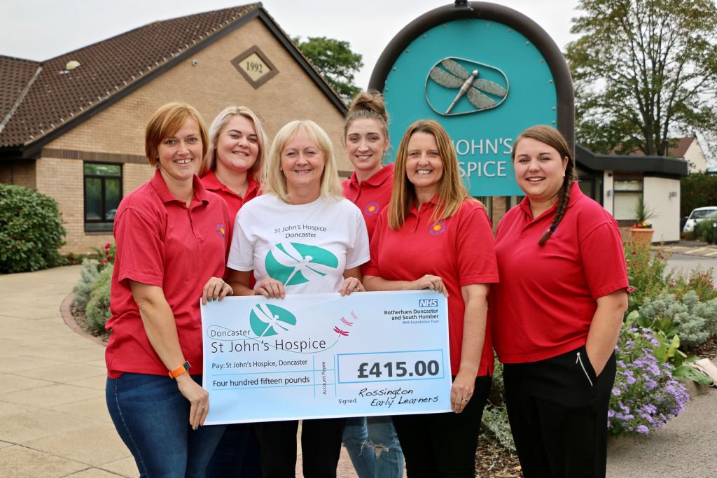 Staff from the Rossington Early Learners are pictured handing over their cheque to Lindsey Richards (centre) of St John’s Hospice.