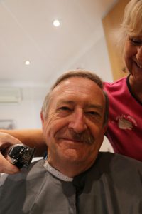 John is pictured during the shave.