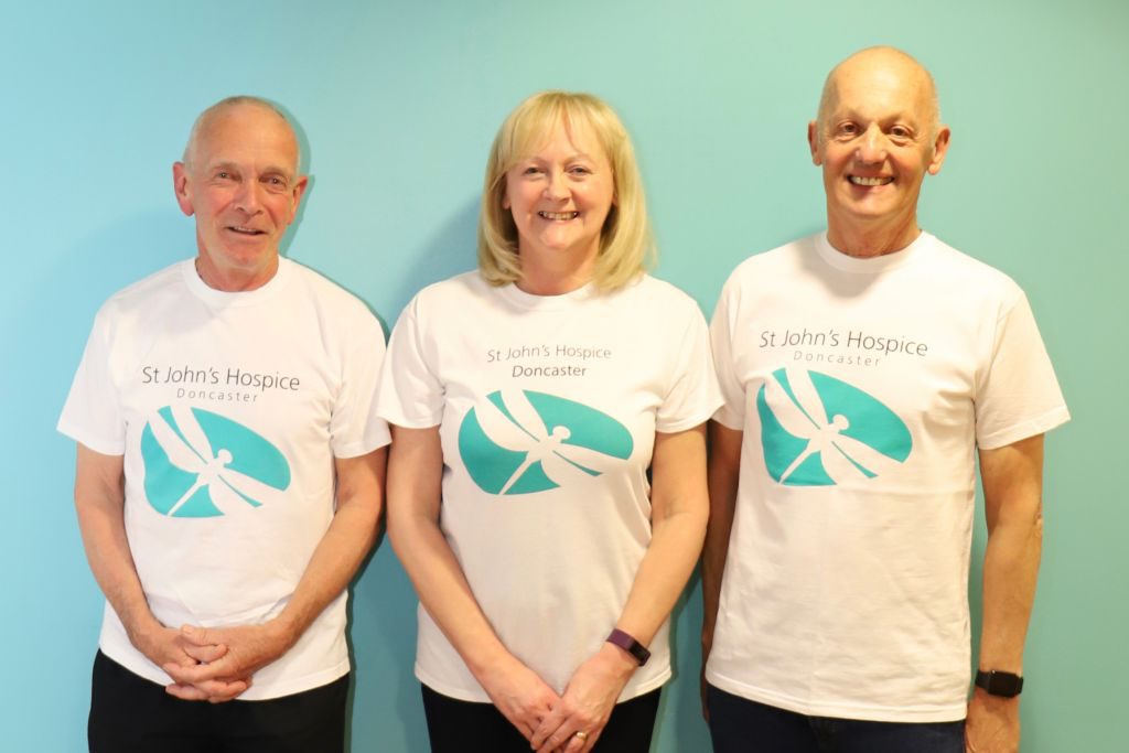 Les Crownshaw (left) is pictured with Lindsey Richards of the Hospice (middle) and Dave Higgins (right)