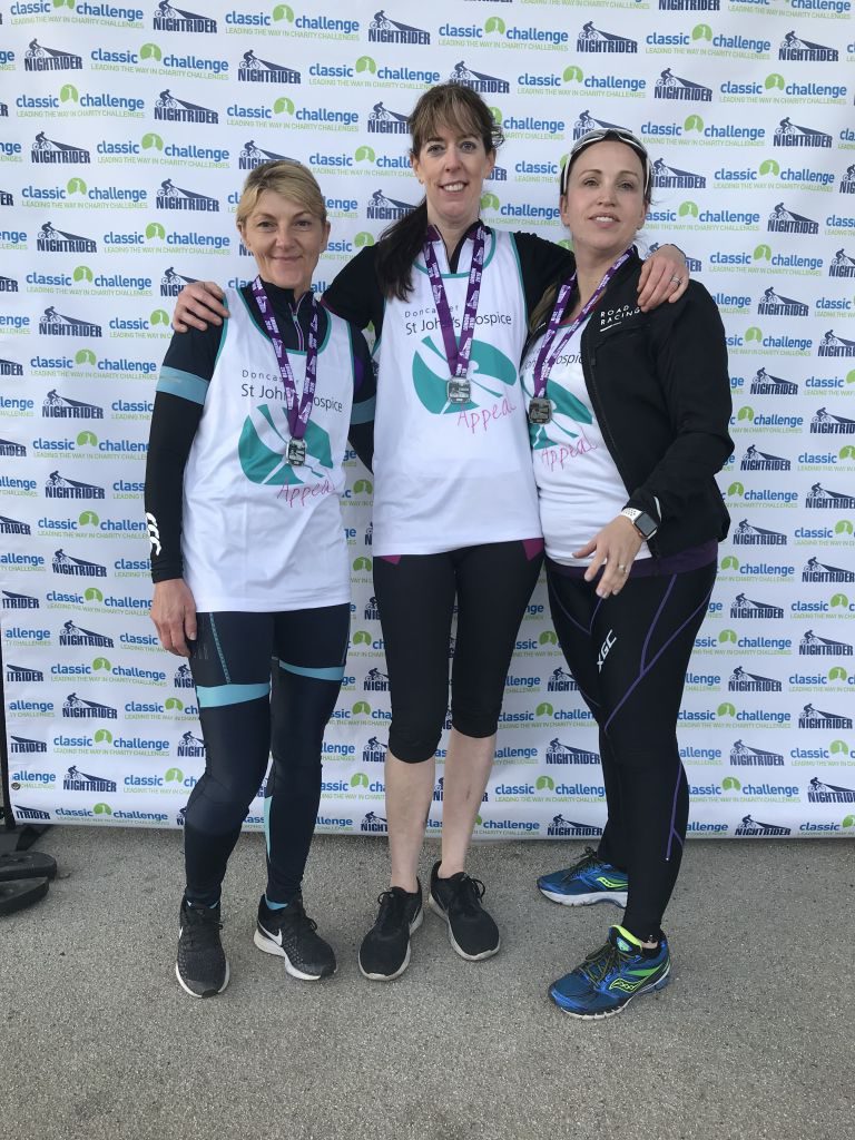 From left to right Michelle Jackson, Janette Piroli and Angela Dickinson with their medals for finishing the night ride.