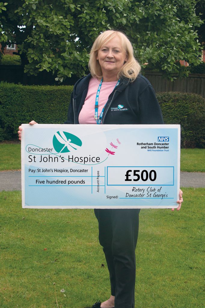 Lindsey Richards of the hospice is pictured with the cheque